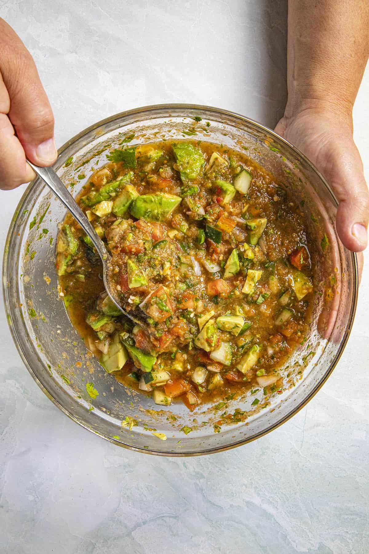 Mixing ingredients to make Mexican Shrimp Cocktail