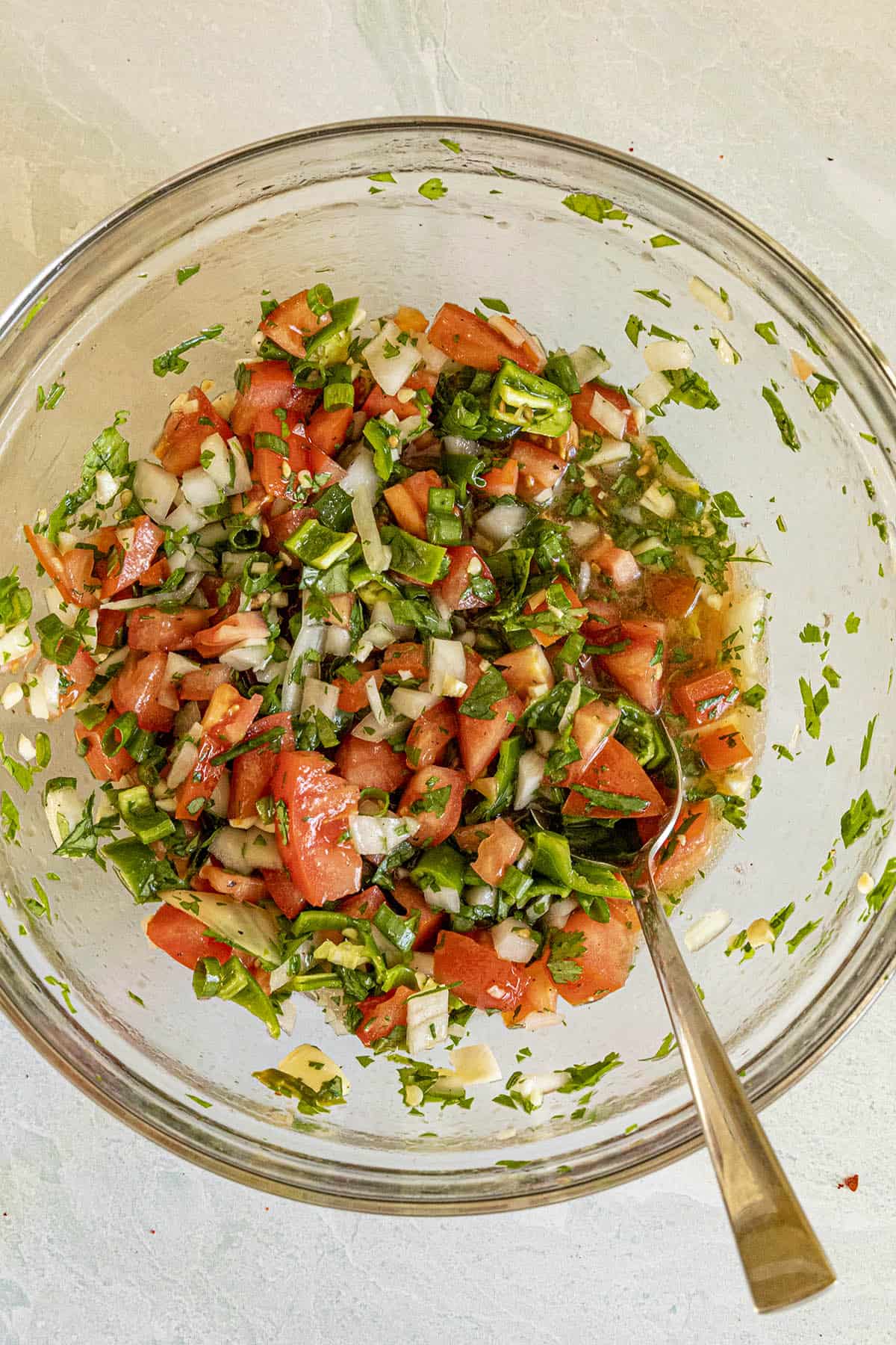 Mixing Pebre in a bowl