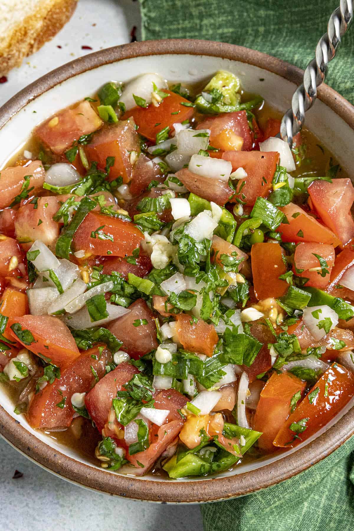 Pebre in a bowl with a spoon