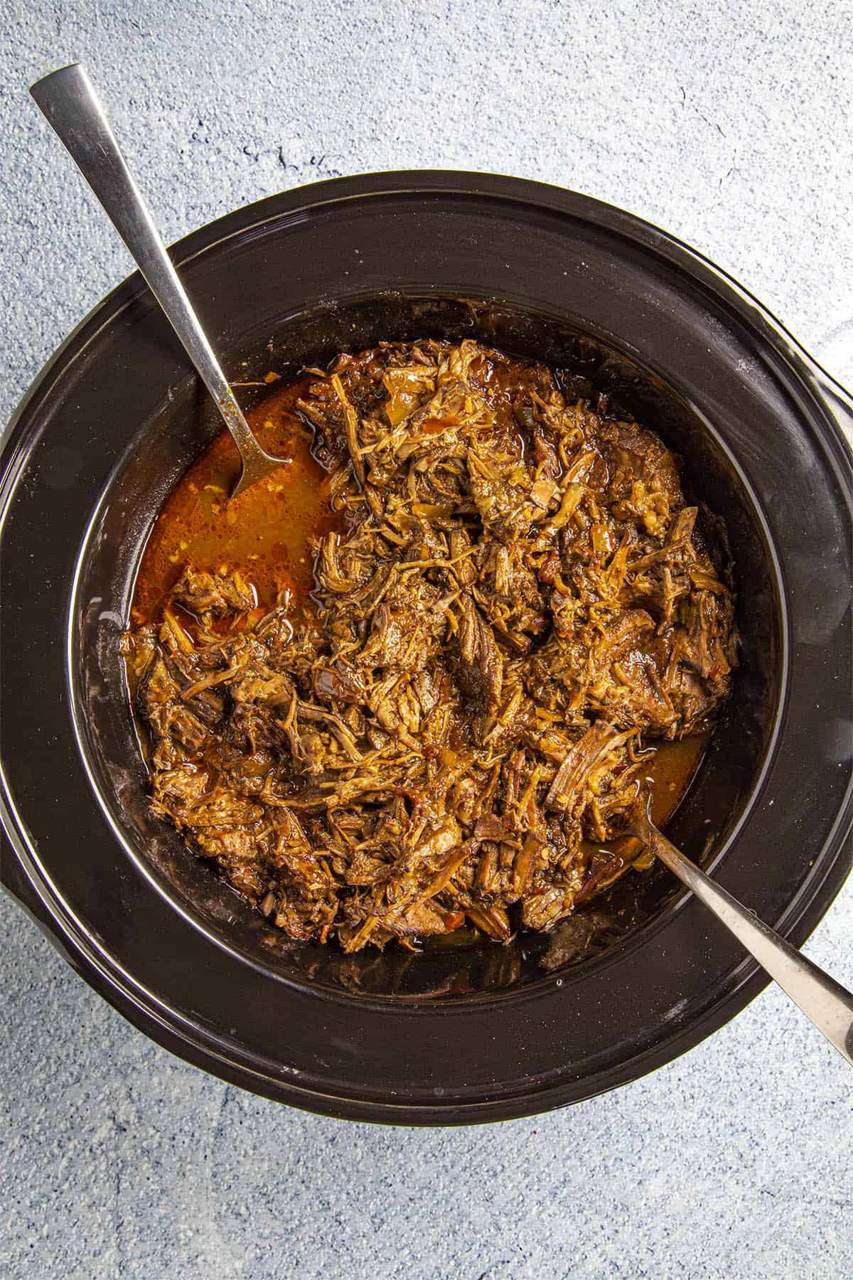 Beef Barbacoa shredded in a slow cooker