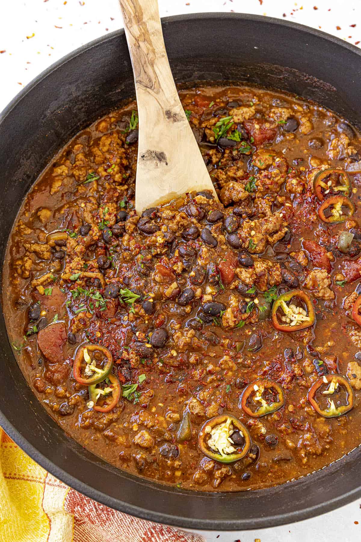 Black Bean Chili in a pot with a serving spoon