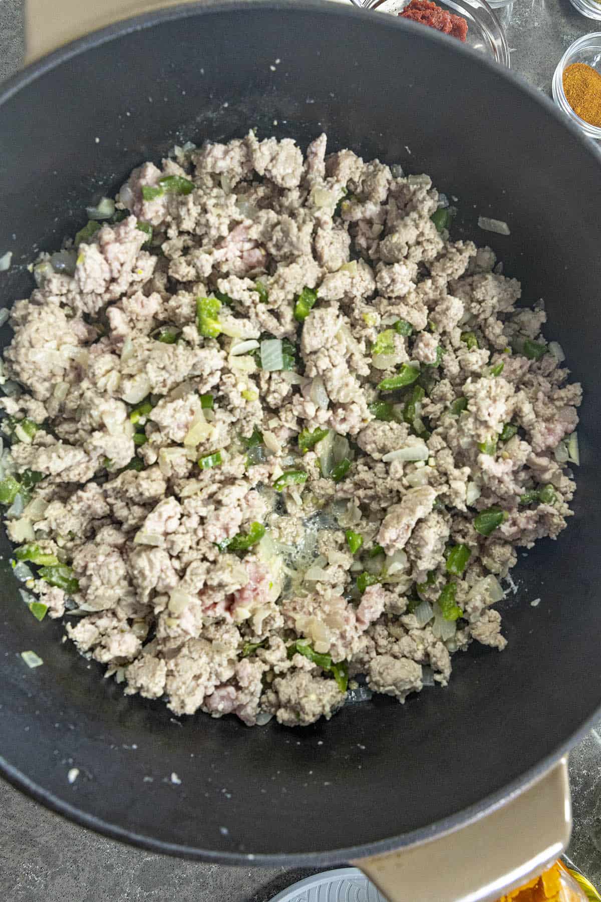 Cooking meats in a pot to make Black Bean Chili