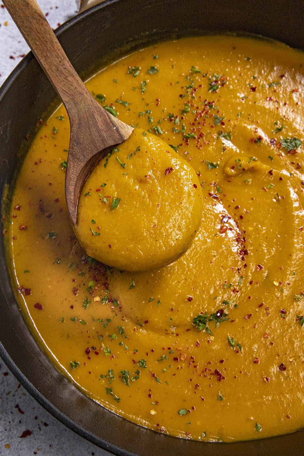 Mike serving a scoop of Butternut Squash Soup