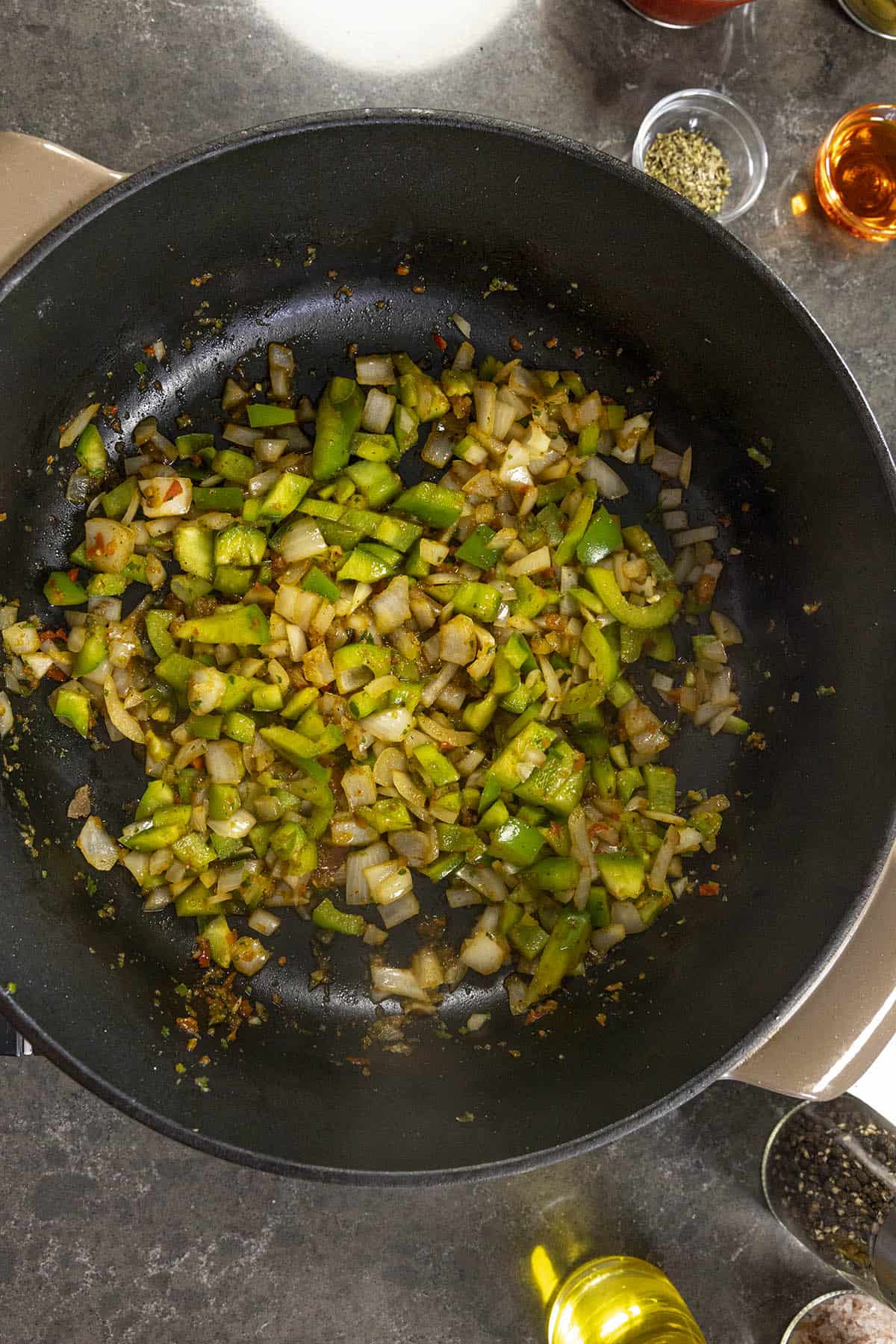 Cooking down the vegetables to make Carne Guisada