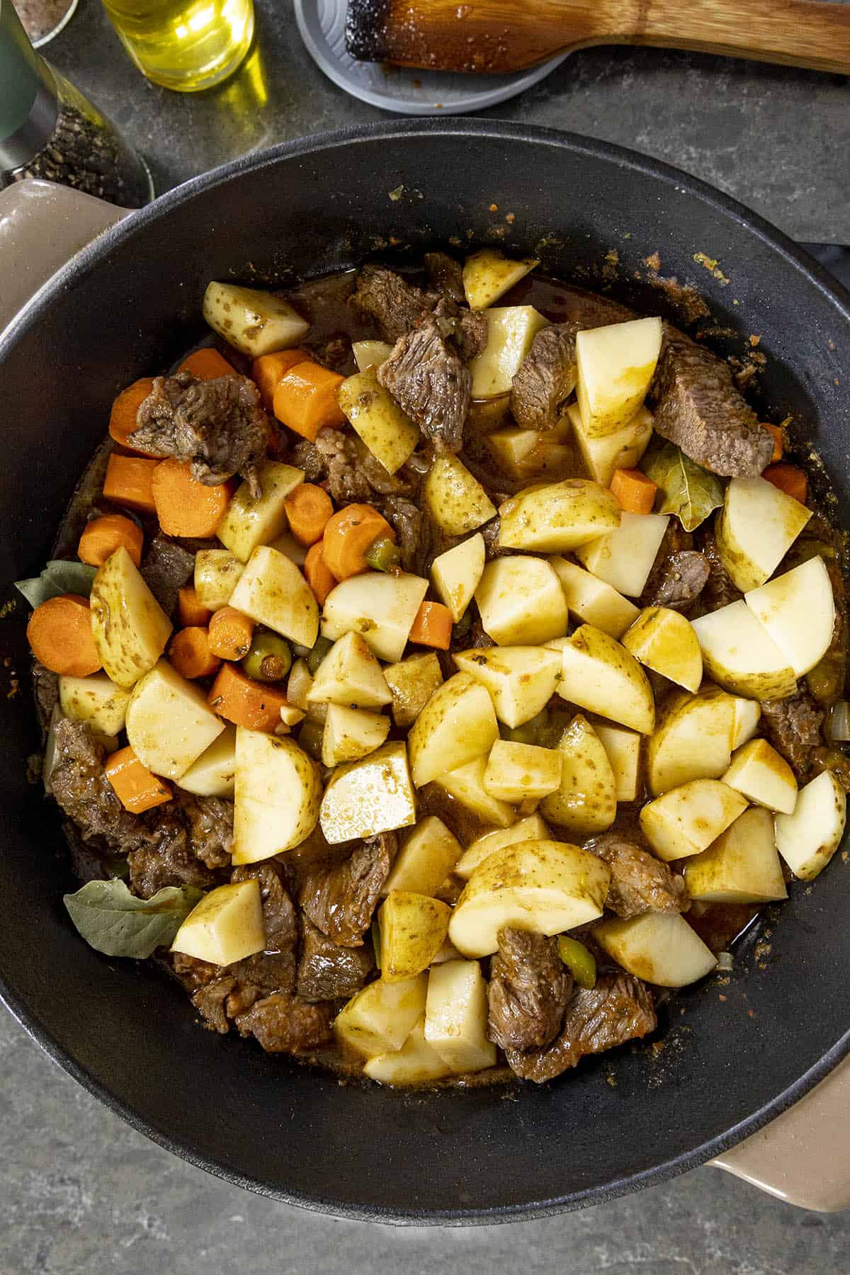 Simmering the root vegetables with the Carne Guisada
