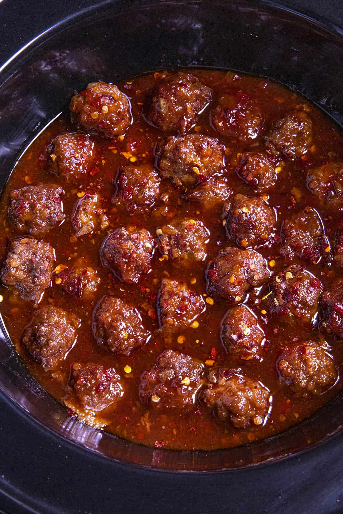 Grape Jelly Meatballs simmering in a crockpot