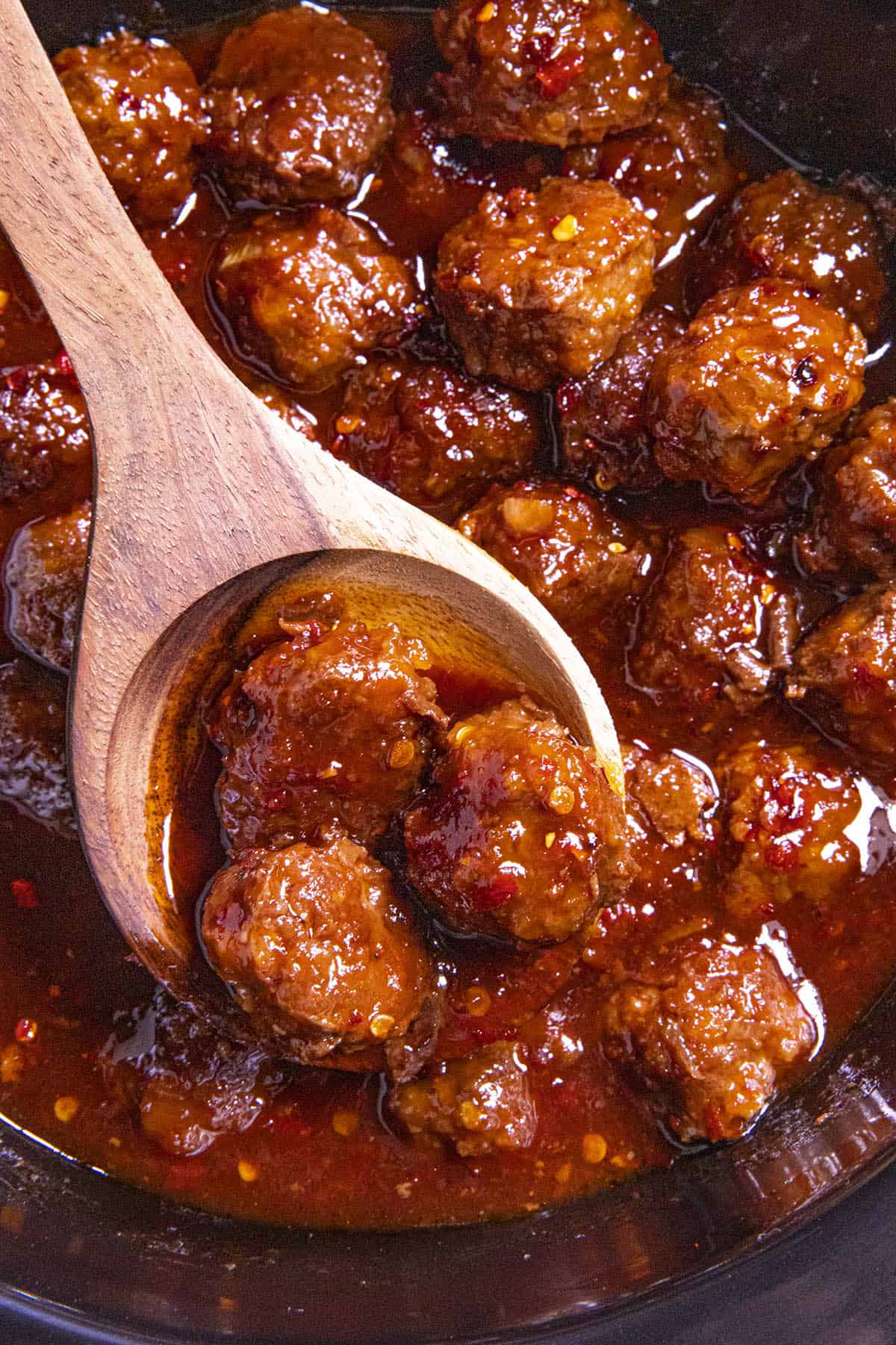 Grape Jelly Meatballs on a serving spoon