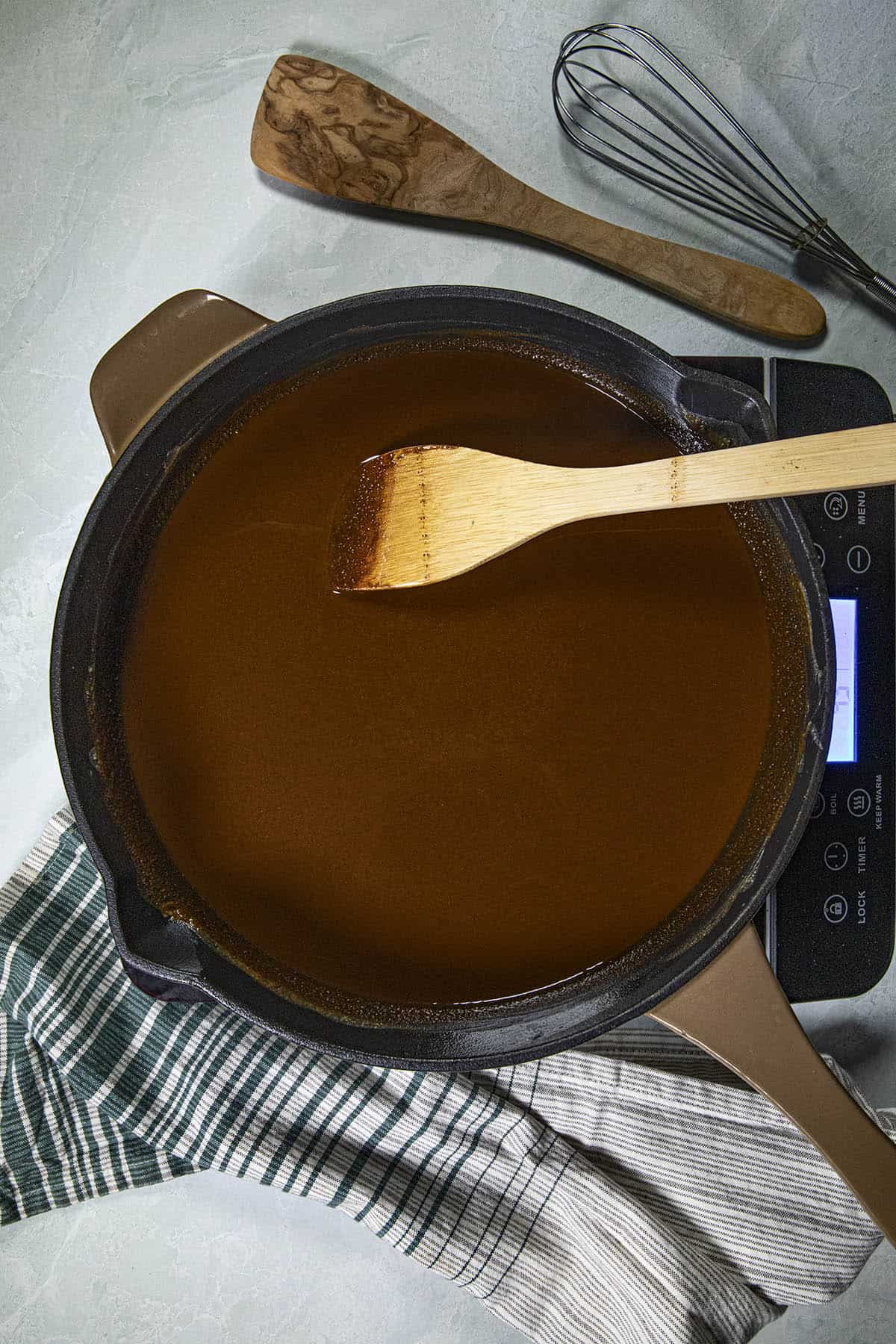 A chocolate colored gumbo roux in a pan