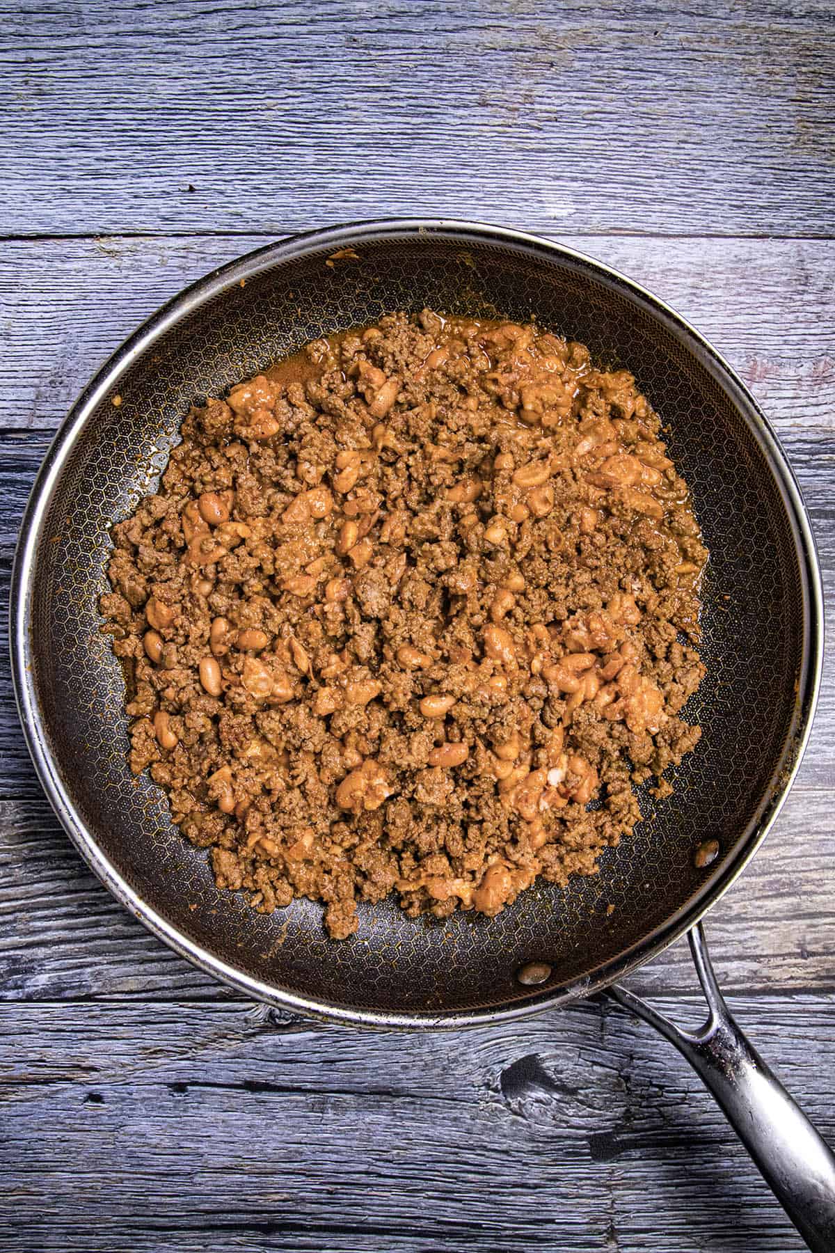 Simmering the taco meat and bean mixture for nachos