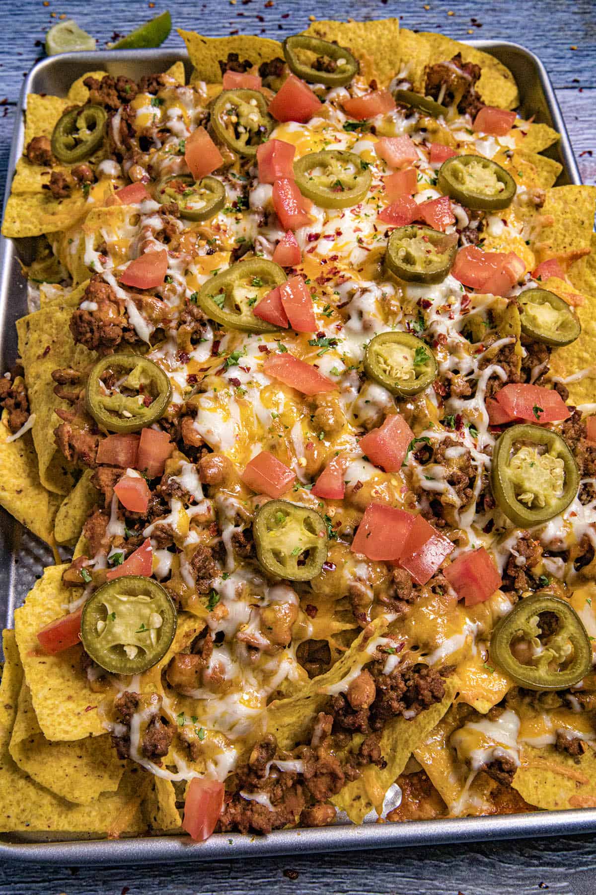 Serving up a large pan of nachos just out of the oven