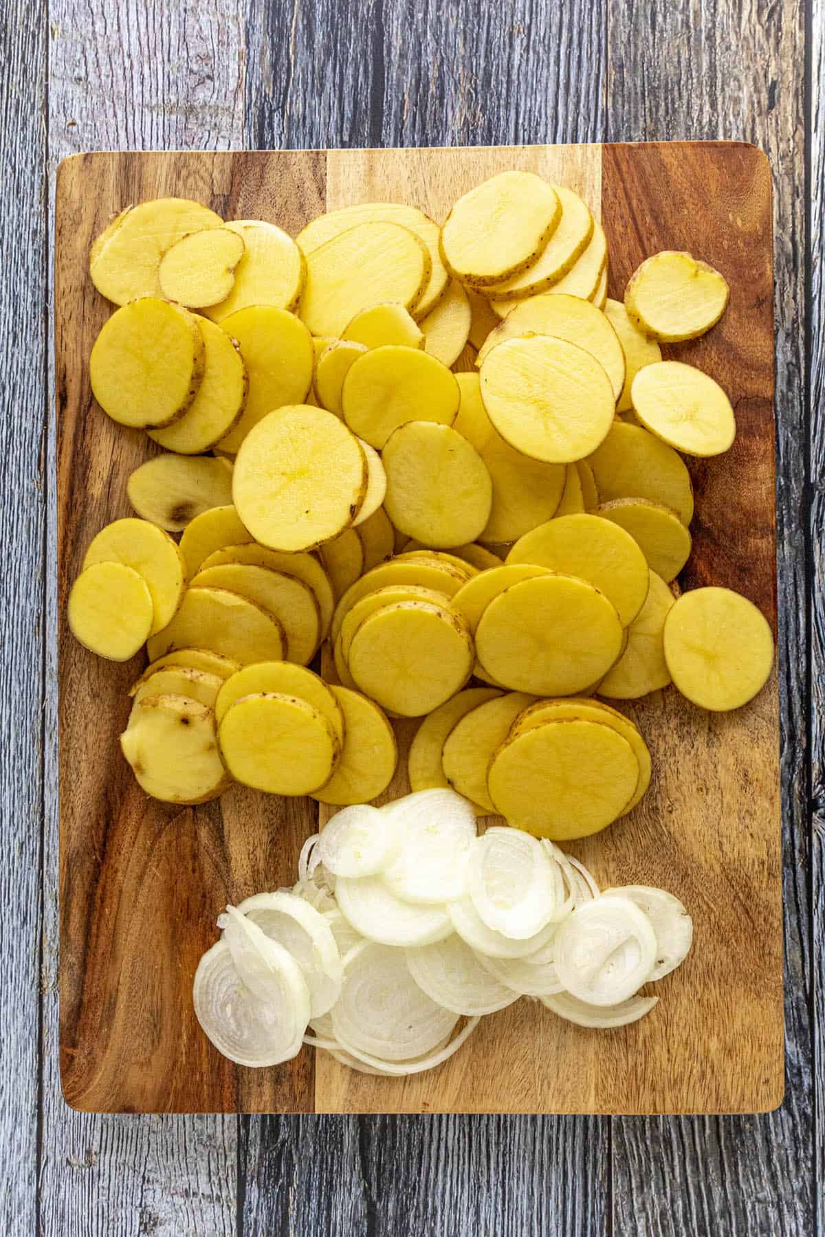 Scalloped Potatoes and Onions on a Cutting Board