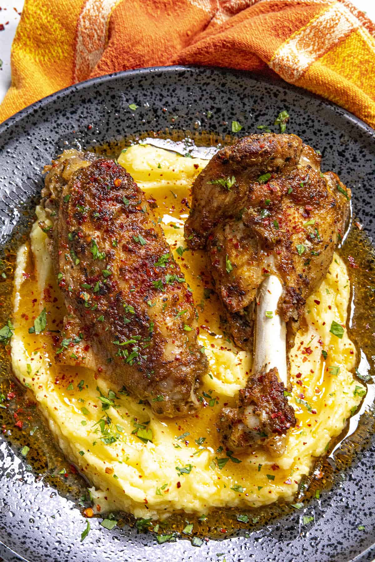 Baked Turkey Wings on a plate, served over mashed potatoes