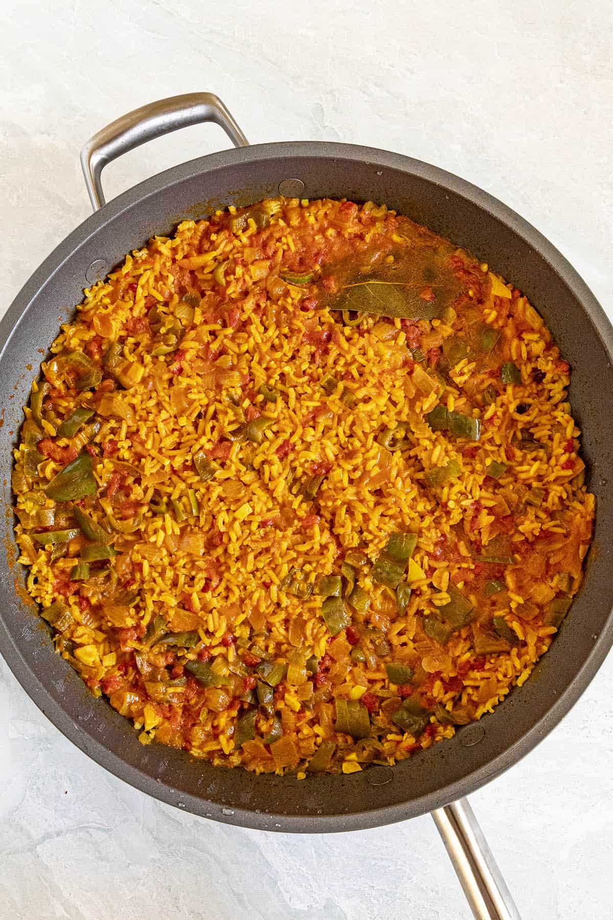 Yellow Rice in a pan, ready for fluffing