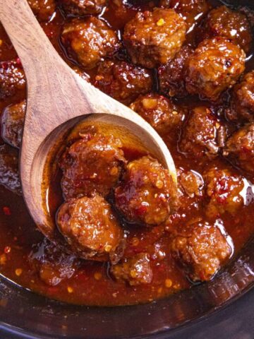 Grape Jelly Meatballs on a serving spoon