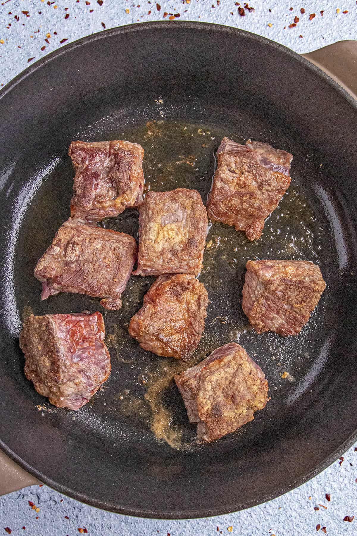 Browning the seasoned beef to make Beef Stew