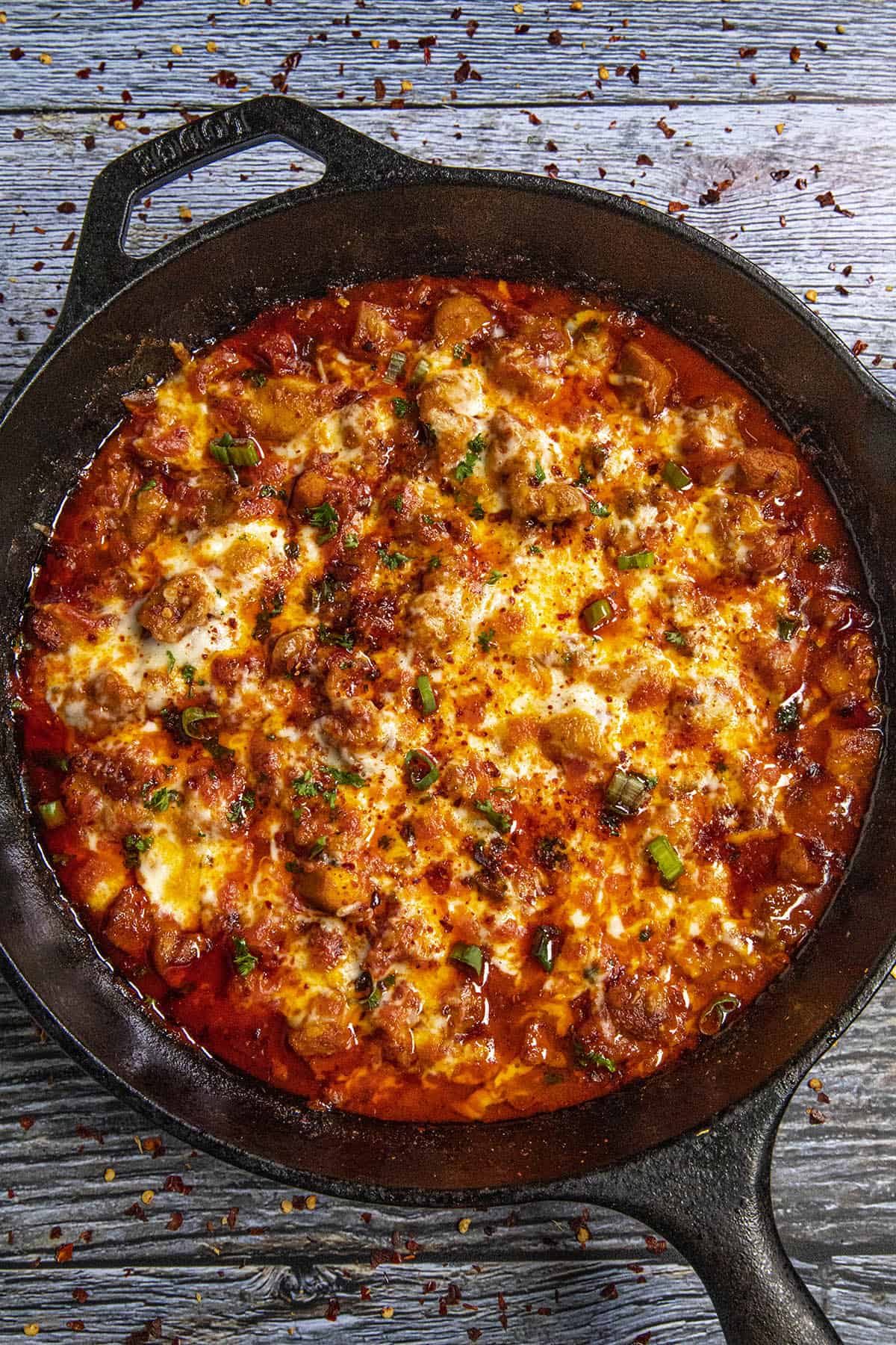 Fiery buldak in a pan with cheese