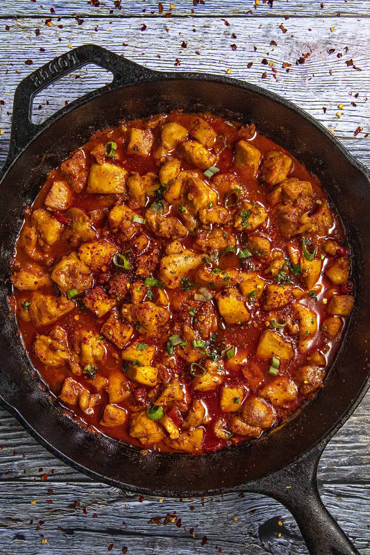 Chunky, spicy buldak in a pan, simmering