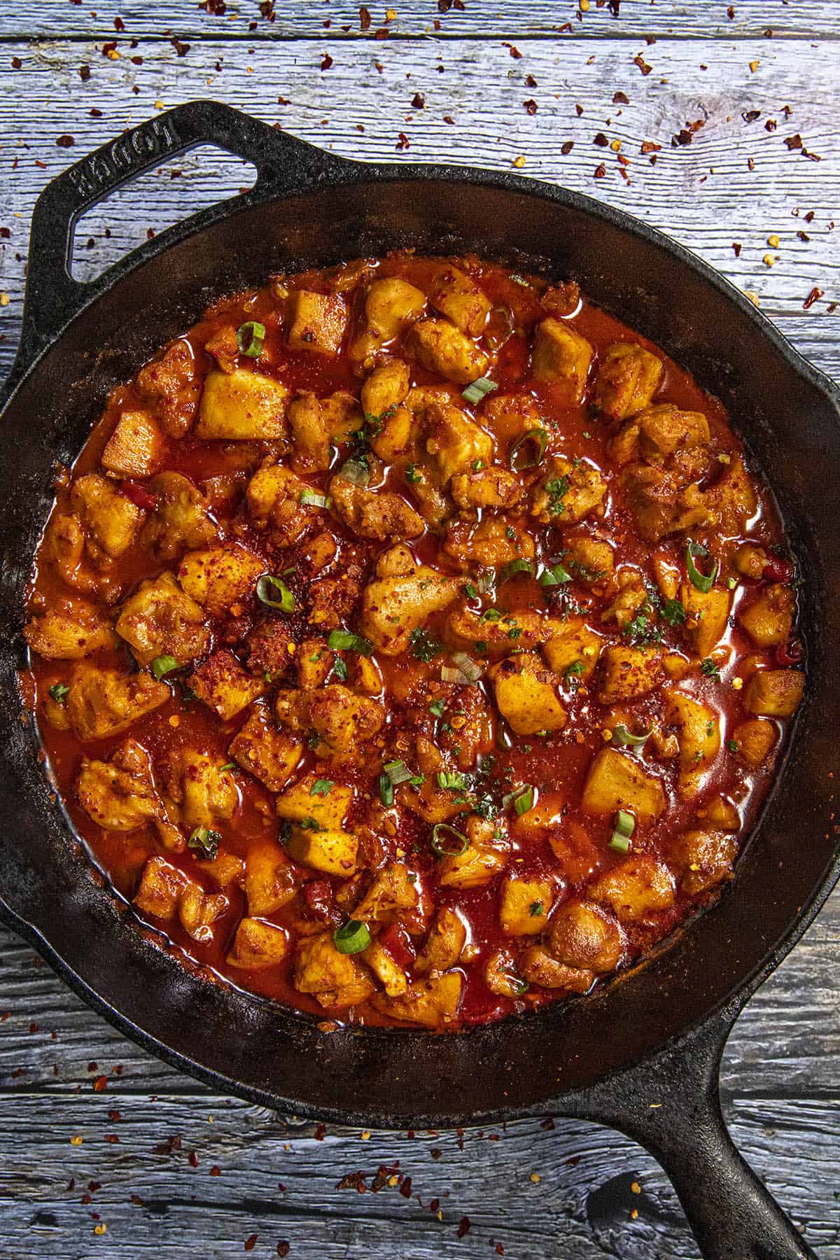Chunky, spicy buldak in a pan, simmering