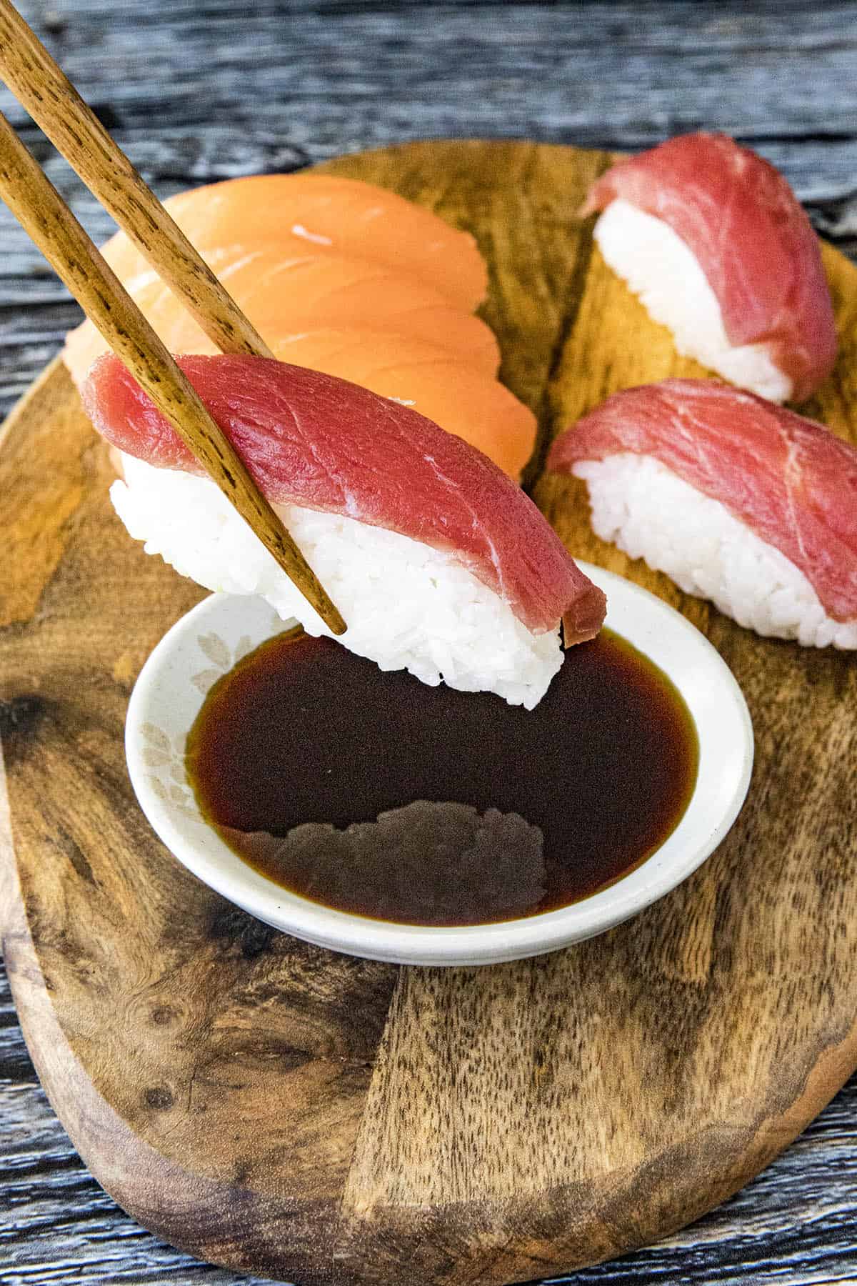 Dipping sushi into a bowl of Ponzu Sauce