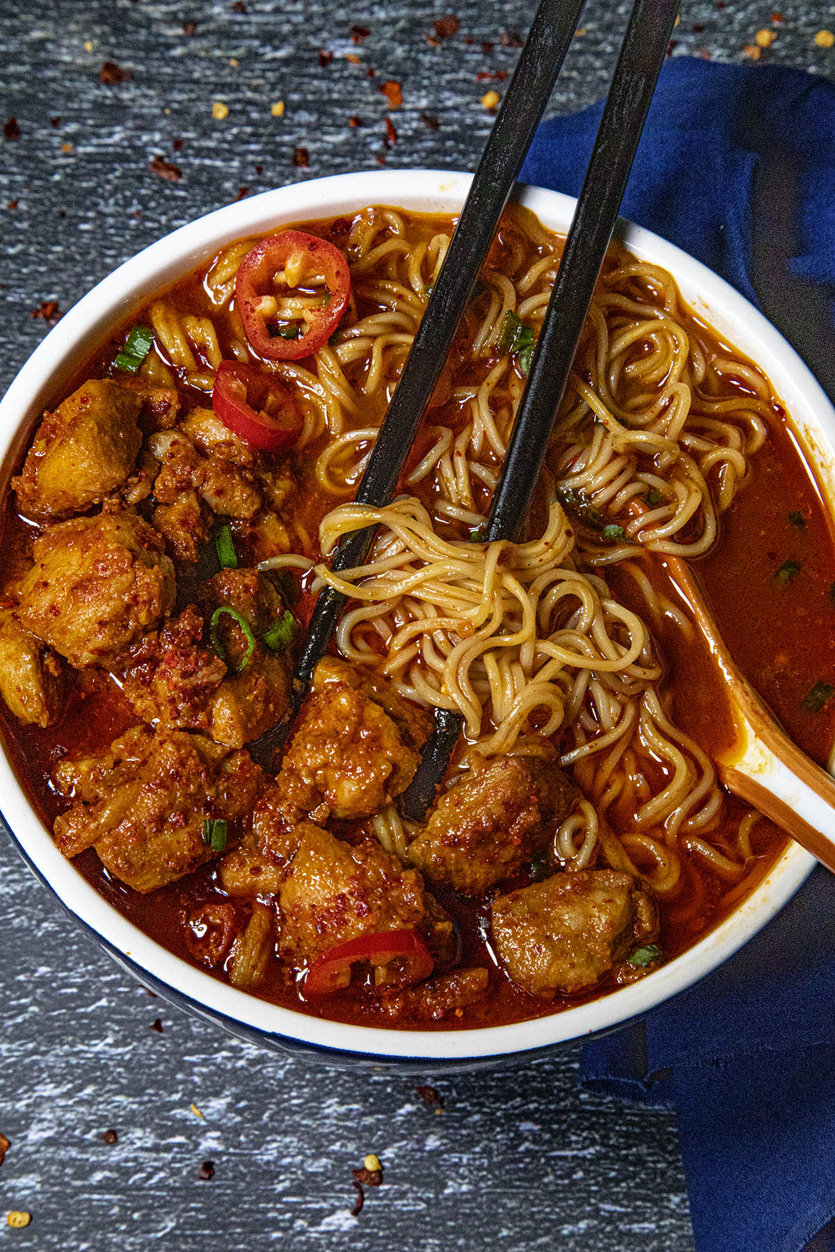 Eating Buldak Ramen with chopsticks