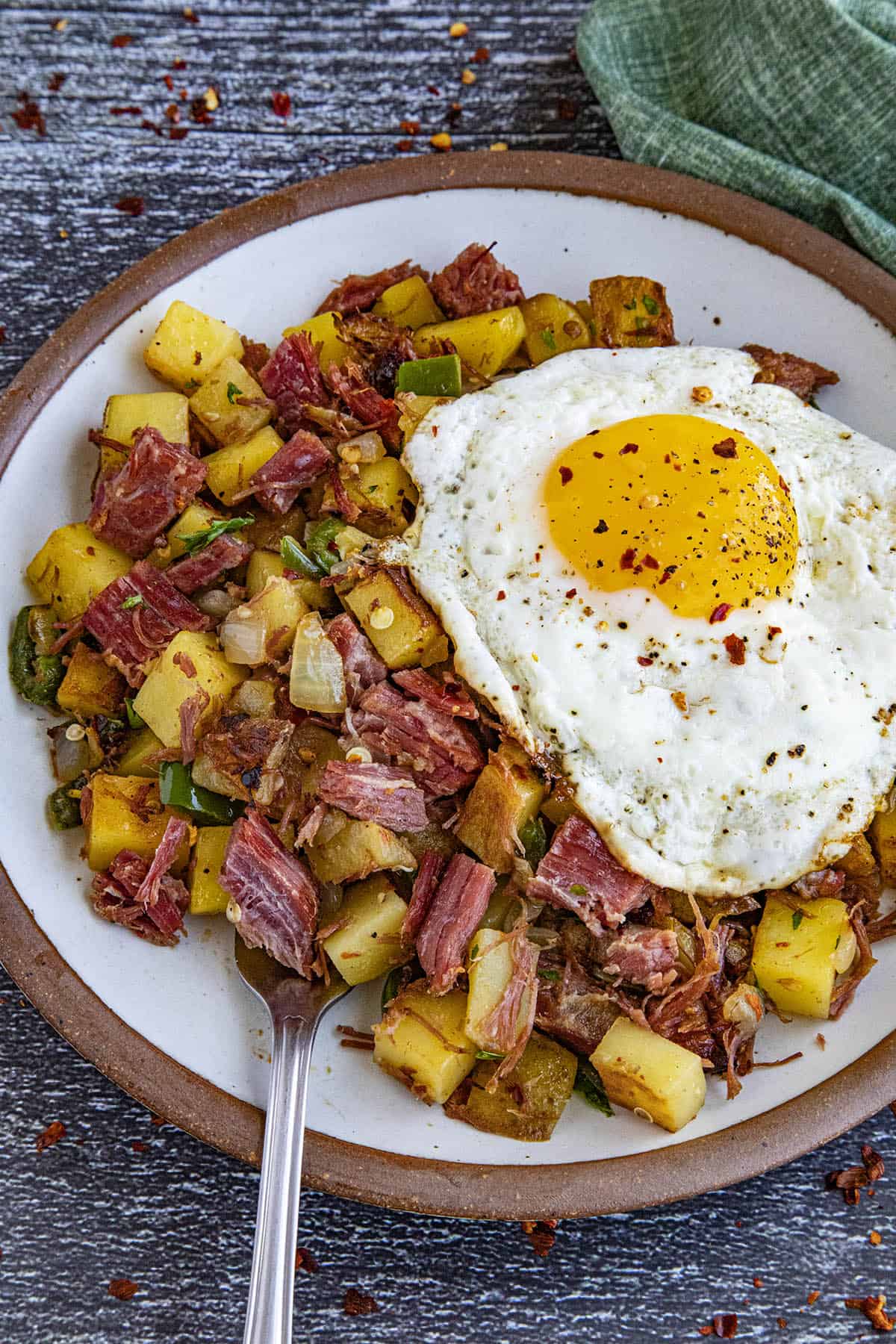 Corned Beef Hash on a plate with a sunny side up egg