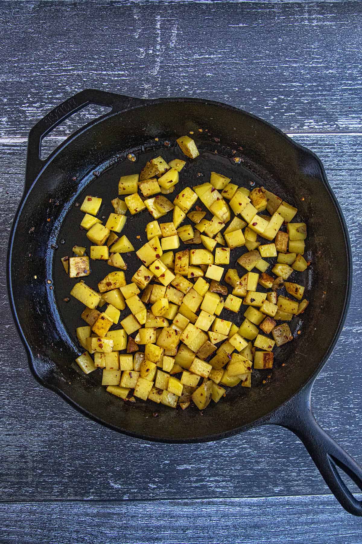 Cooking cubed potatoes to make Corned Beef Hash