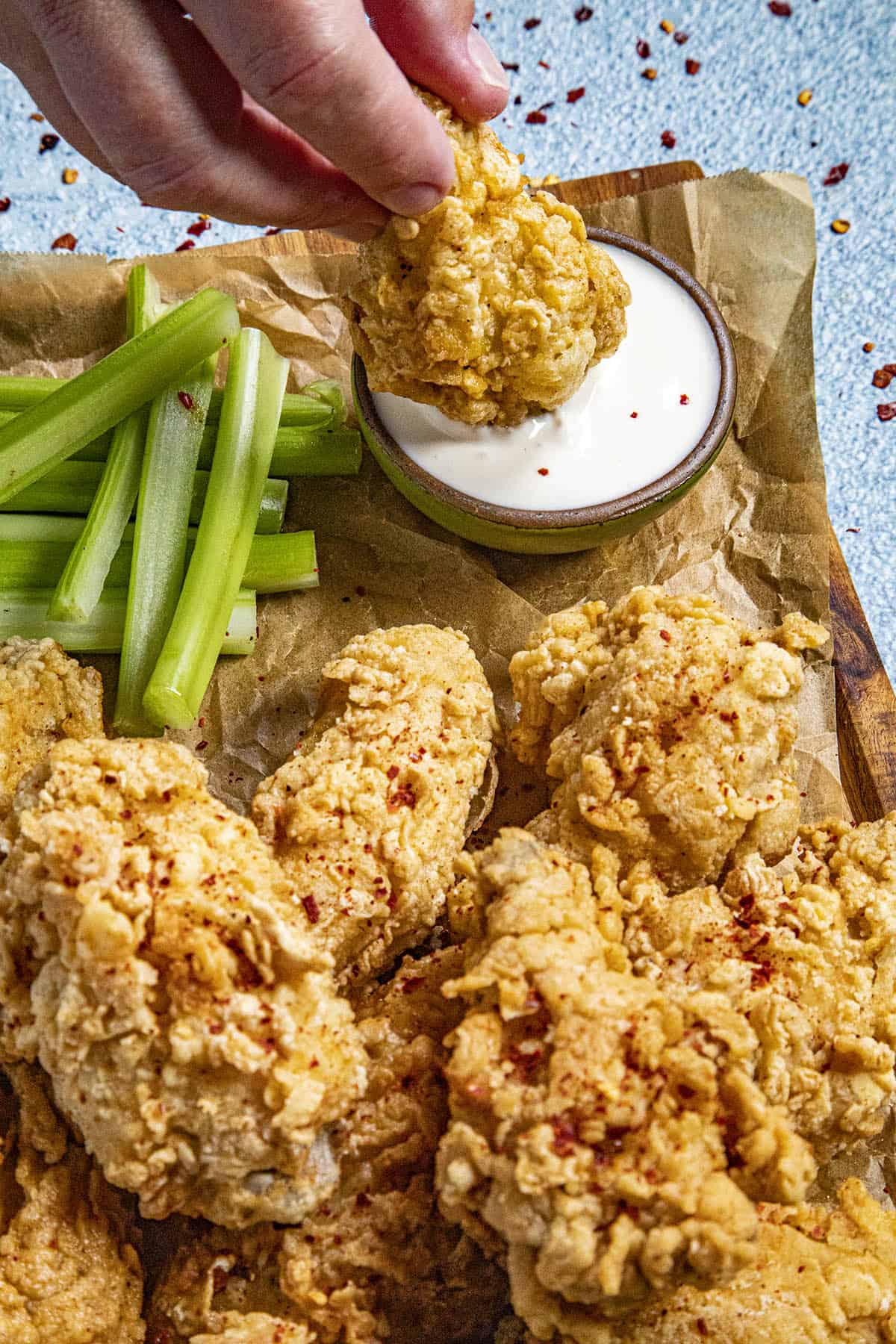 Dipping a Fried Chicken Wing into ranch dressing