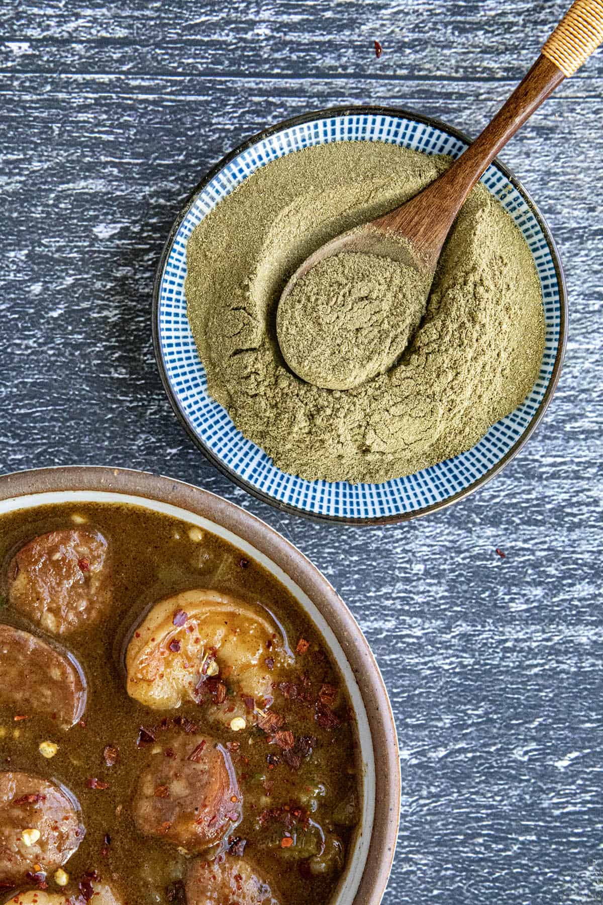 Gumbo File Powder in a bowl with a spoon