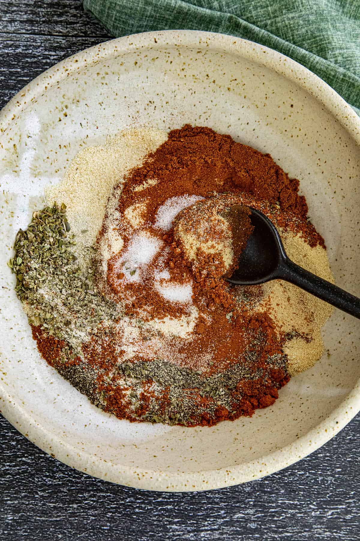 Mixing Cajun spices in a bowl to make Homemade Cajun Seasoning