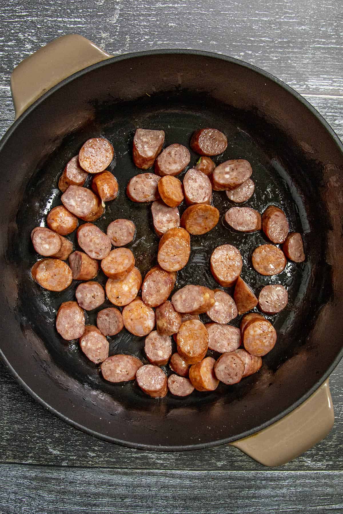 Browning andouille sausage to make Shrimp Gumbo