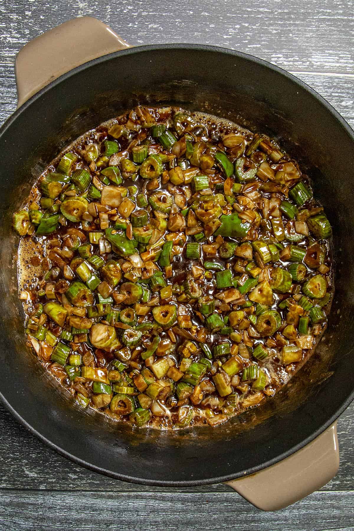 Cooking vegetables in roux to make Shrimp Gumbo