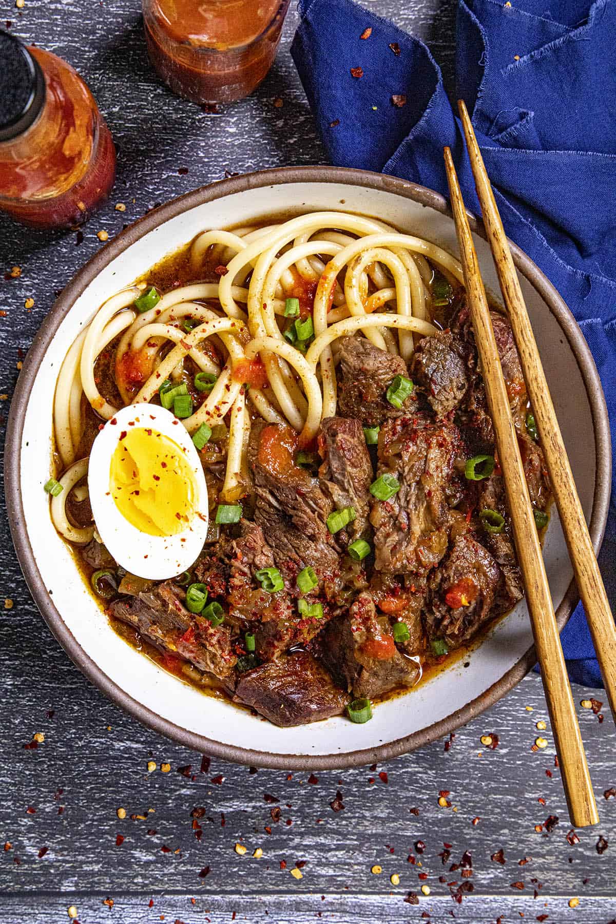 Yakamein in a bowl with chopsticks, ready to serve