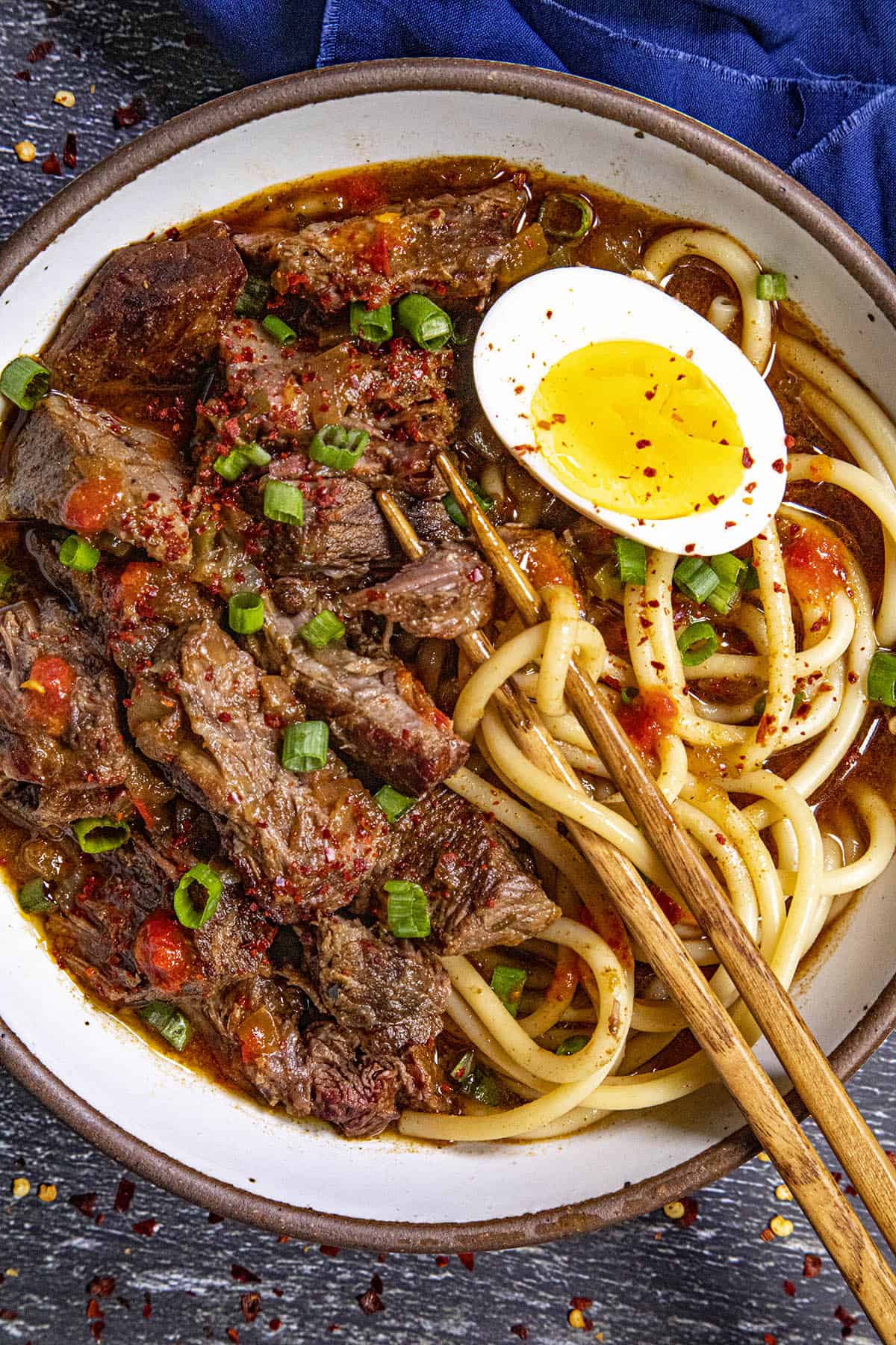 Yakamein in a bowl with chopsticks