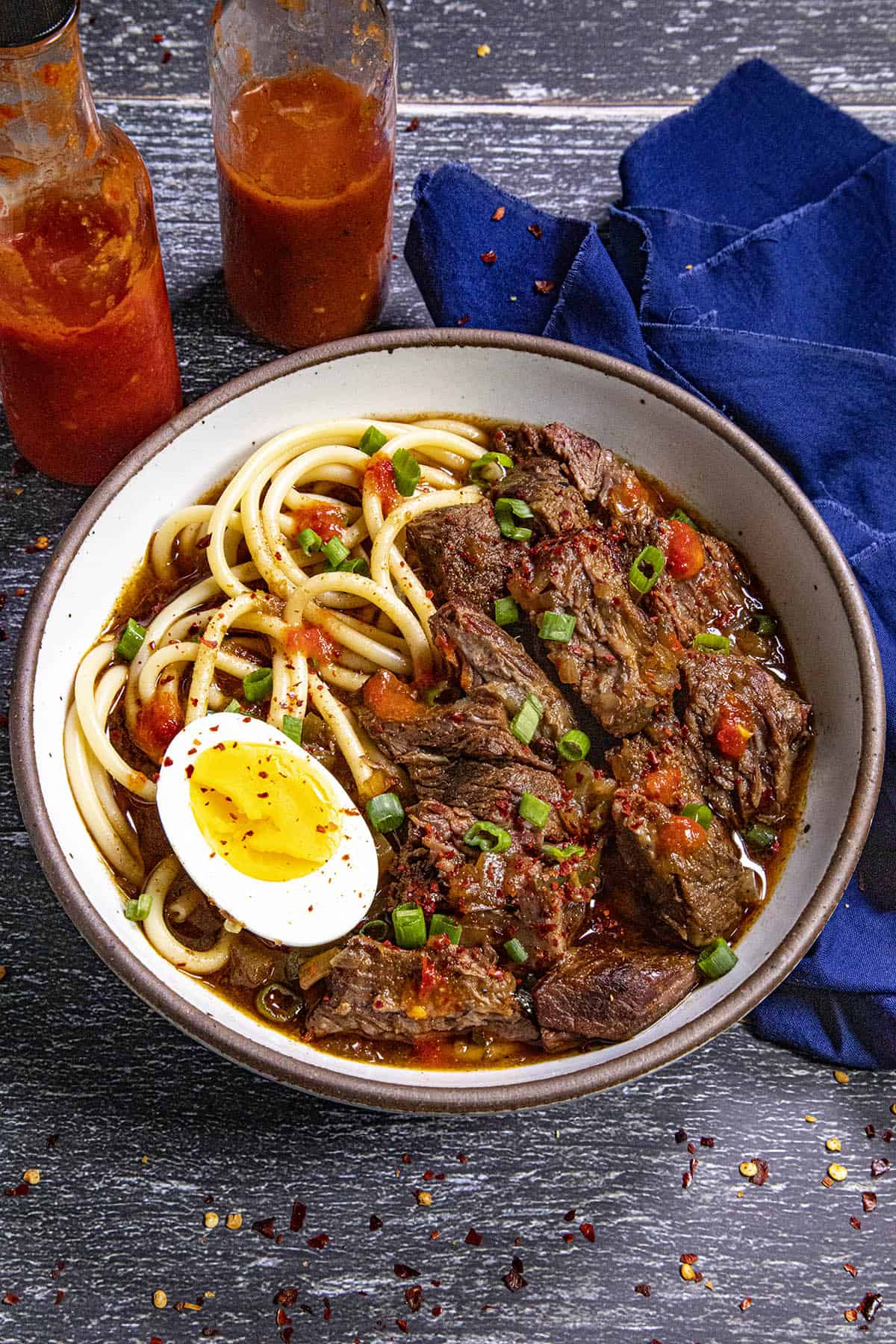 A large bowl of Creole Beef Noodle Soup, or yakamein.