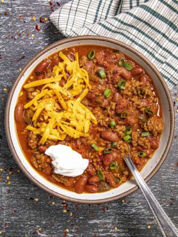 Homemade Chili loaded with cheese and sour cream