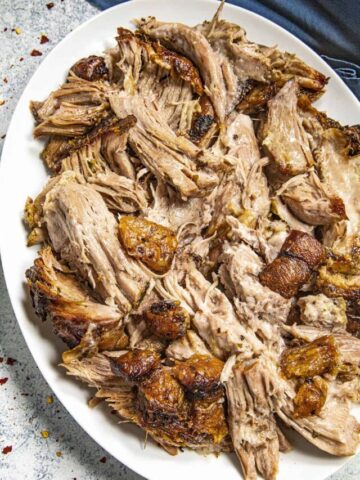 Puerto Rican Roast Pork on a plate (Pulled Pernil)