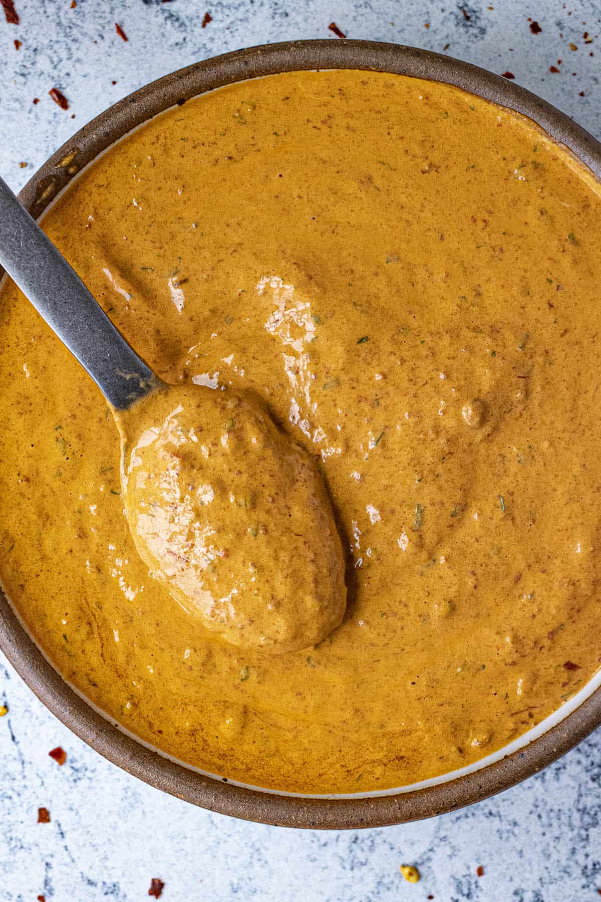 Creamy chipotle sauce in a serving bowl with a spoon