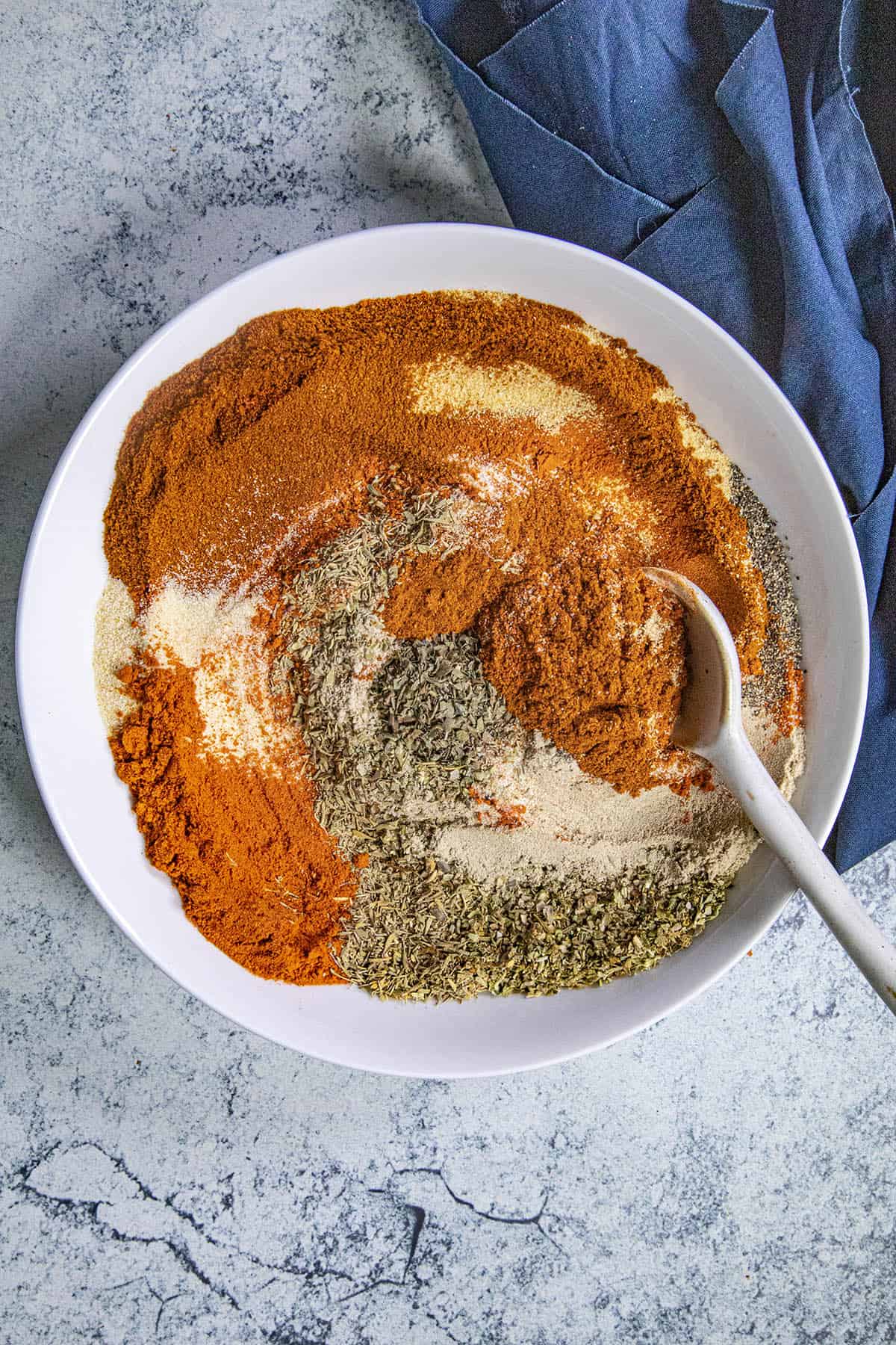 Mxing Creole Seasoning in a bowl