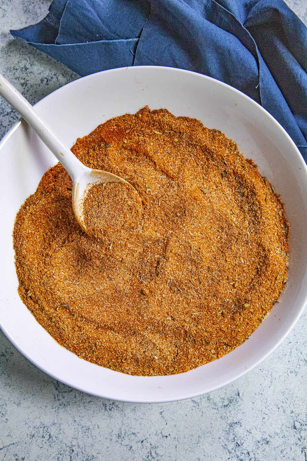 Scooping Homemade Creole Seasoning from the bowl