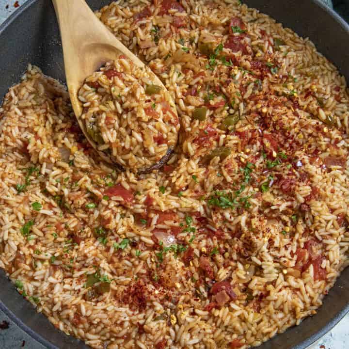 A pan of Charleston Red Rice with serving spoon