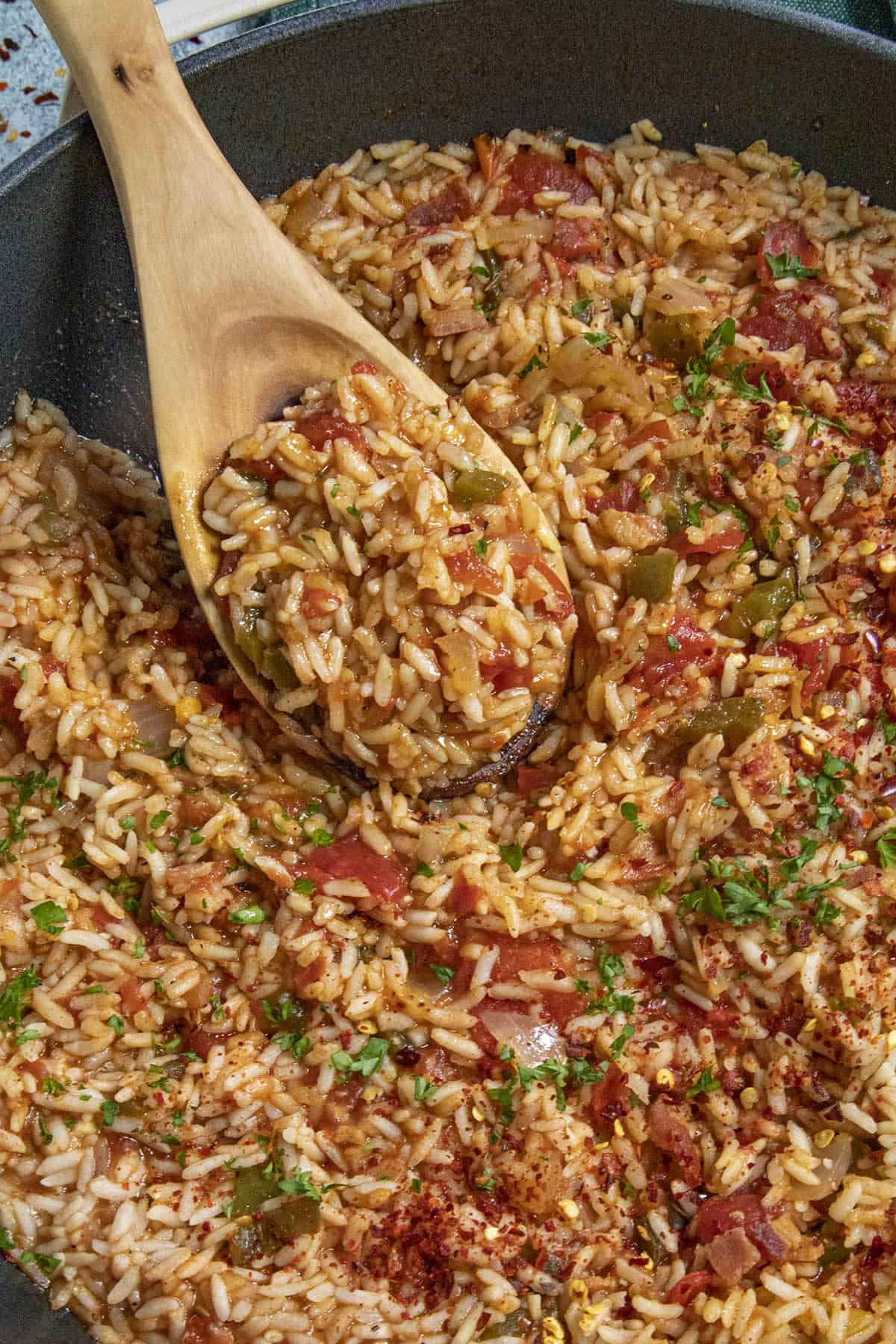 Mike taking a big scoop of Charleston Red Rice from the pan