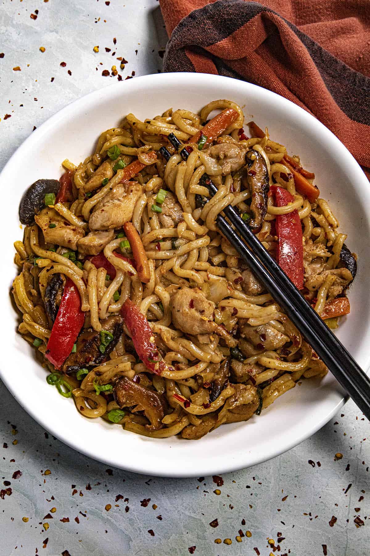 Chicken Yaki Udon in a bowl with chopsticks