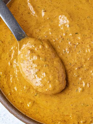 Creamy Chipotle Sauce on a serving spoon