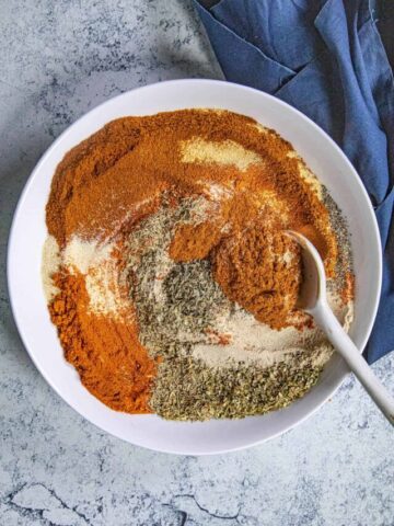 Mxing Creole Seasoning in a bowl