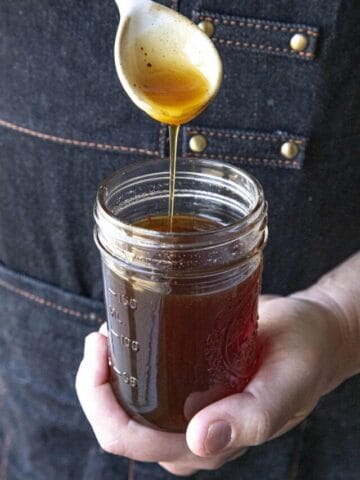 Hot honey dripping into a jar