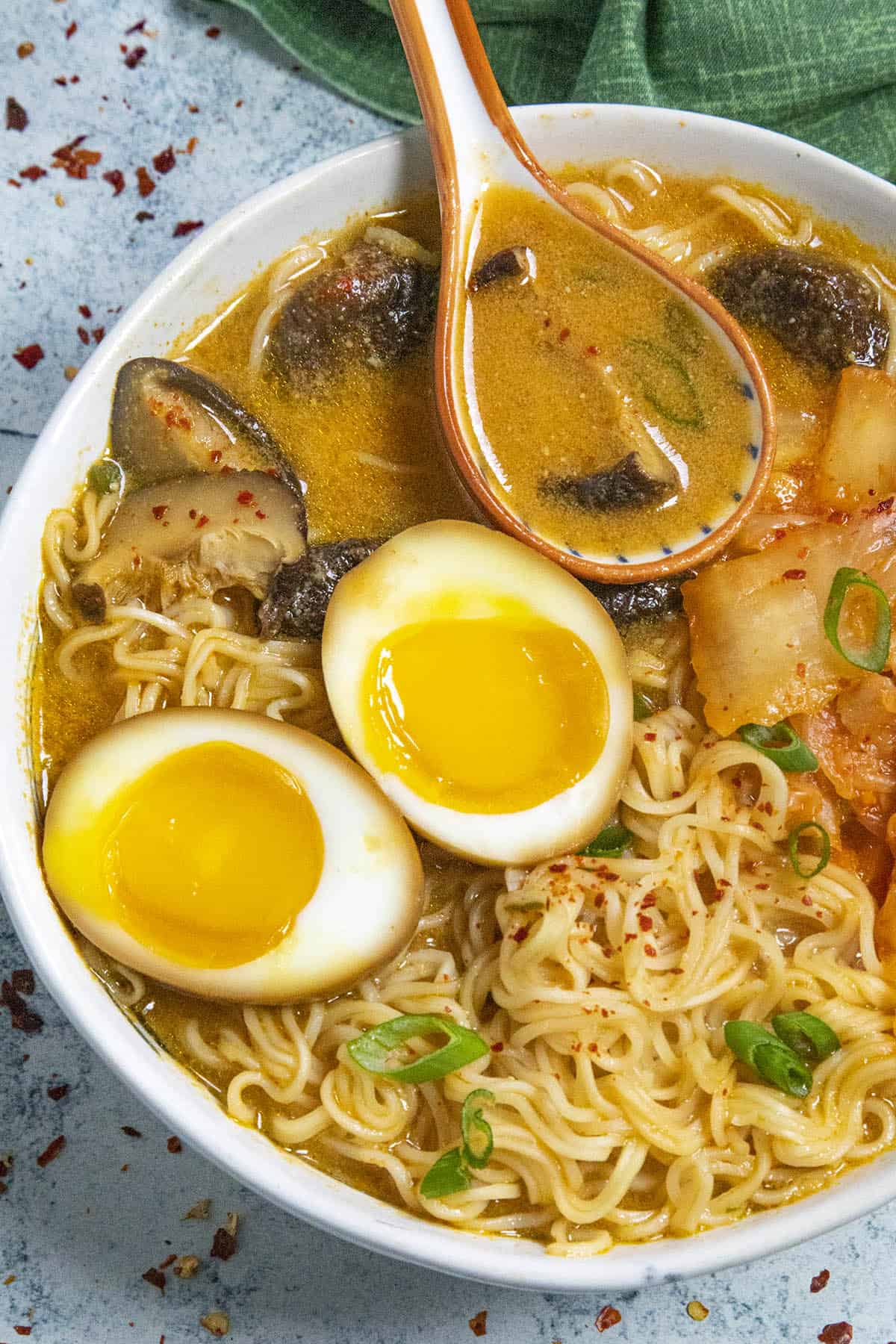 Kimchi Ramen noodles in a bowl with jammy ramen eggs