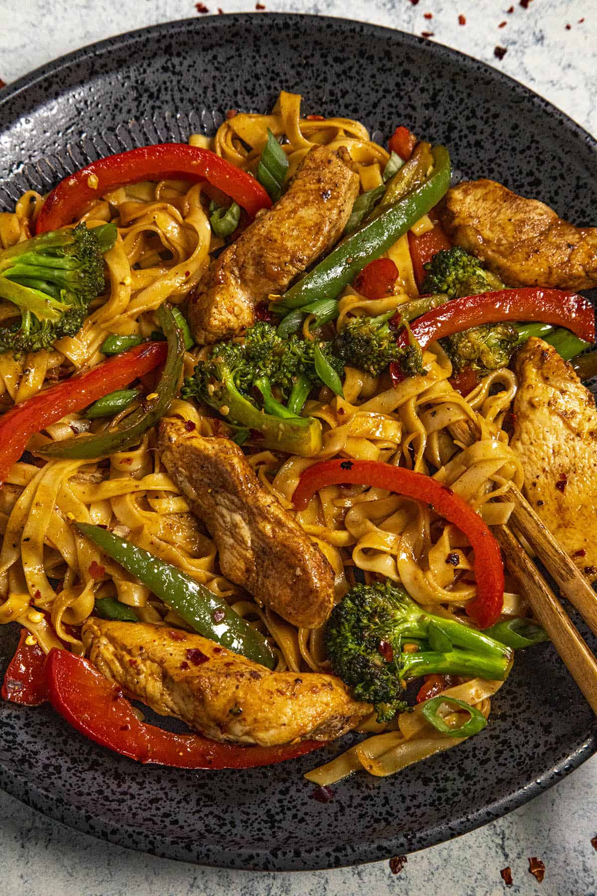 A plate of XO Sauce noodles stir fry with chicken