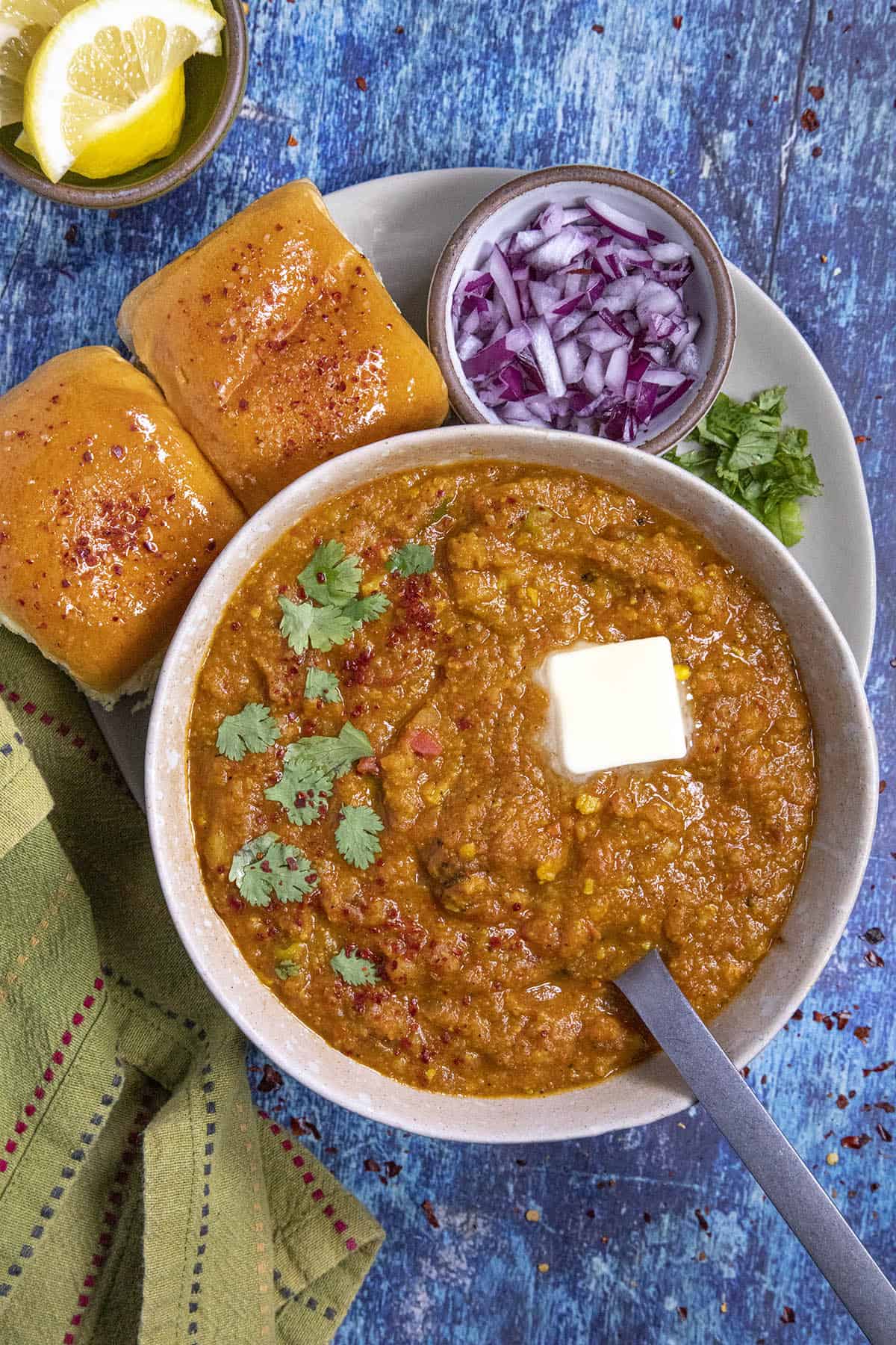 Spicy Pav Bhaji in a bowl with a dollop of butter on top