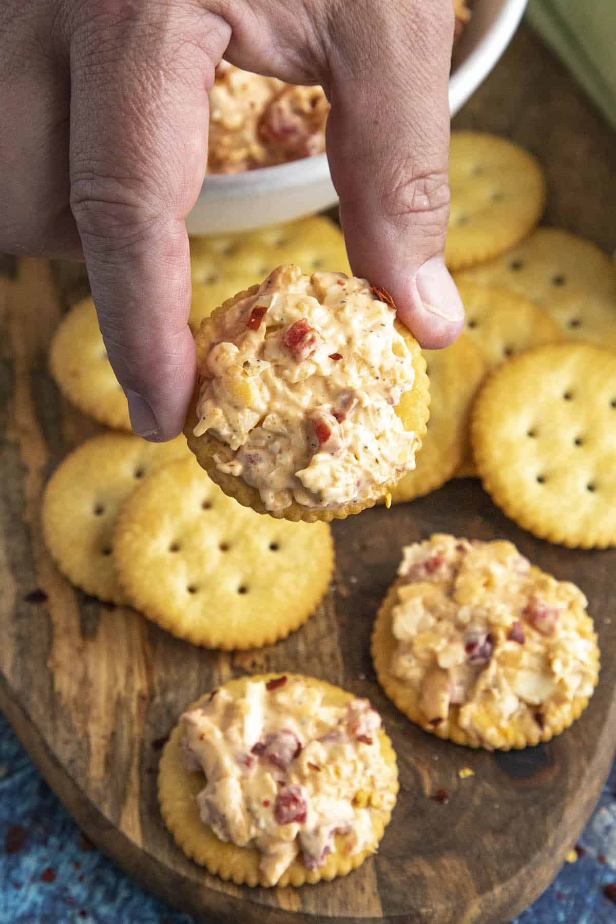 Mike taking a cracker topped with delicious Pimento Cheese