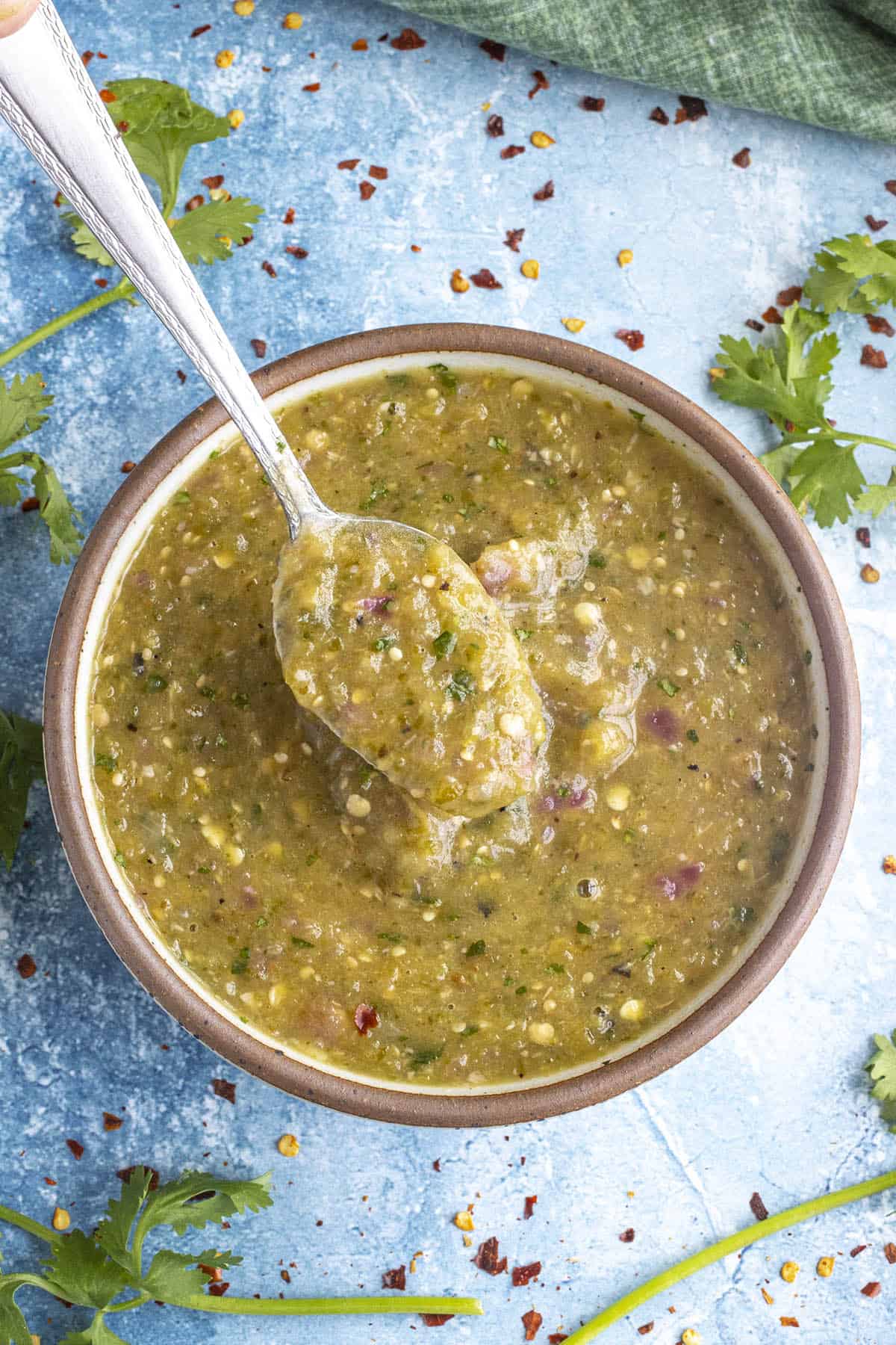 Creamy Tomatillo Sauce in a bowl with a spoon